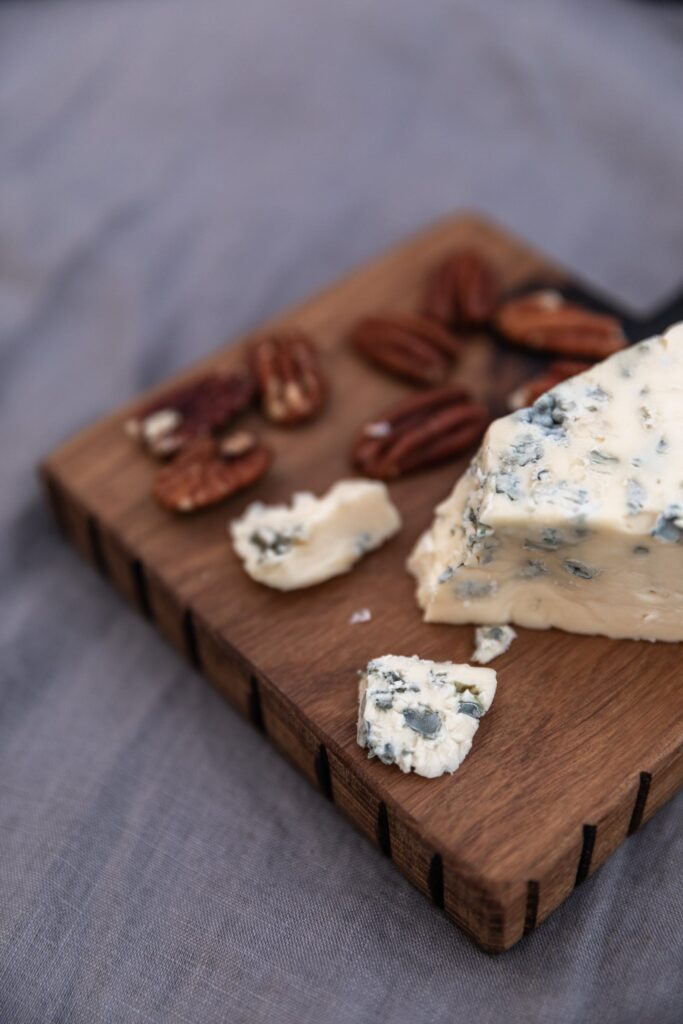 Blue Cheese and Pecans on a Cutting Board 